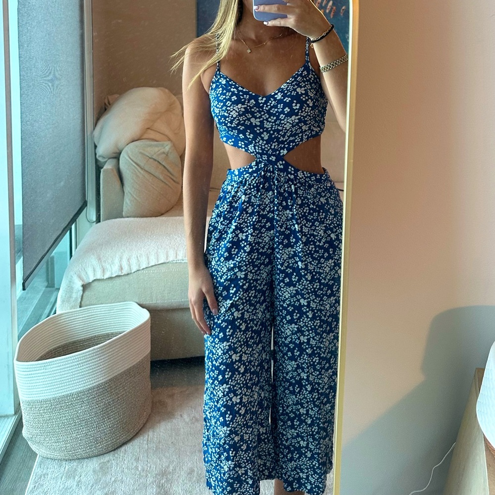 Cut out sides blue and white floral jumpsuit perfect for summer!